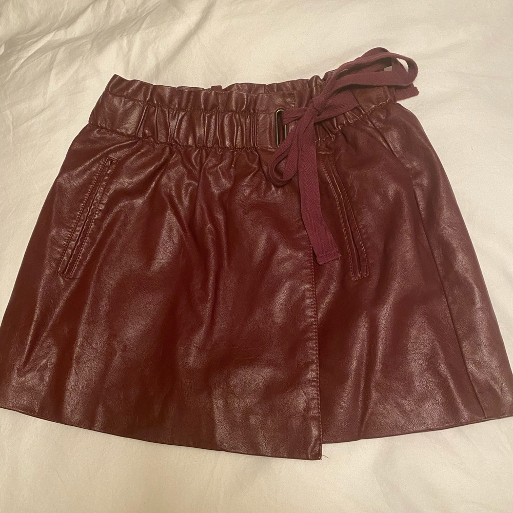 Burgundy faux leather mini skirt. Never worn!